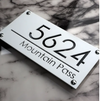 white color house sign
