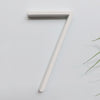 white house numbers, white street address sign, modern white slim house numbers, number 7 seven  white