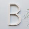 white house numbers, white street address sign, modern white slim house numbers, letter B white