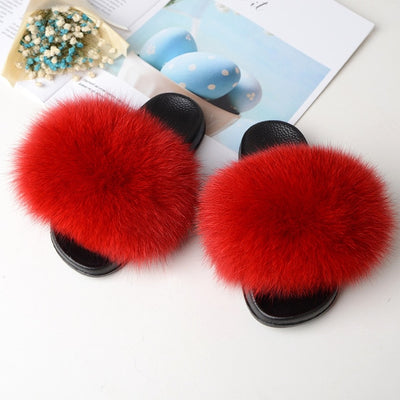red kids fox fur slides slippers with black rubber soles