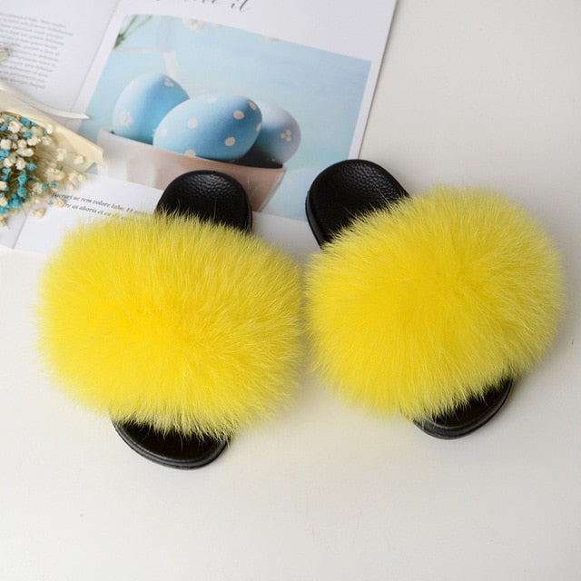 yellow kids fox fur slides slippers with black rubber soles